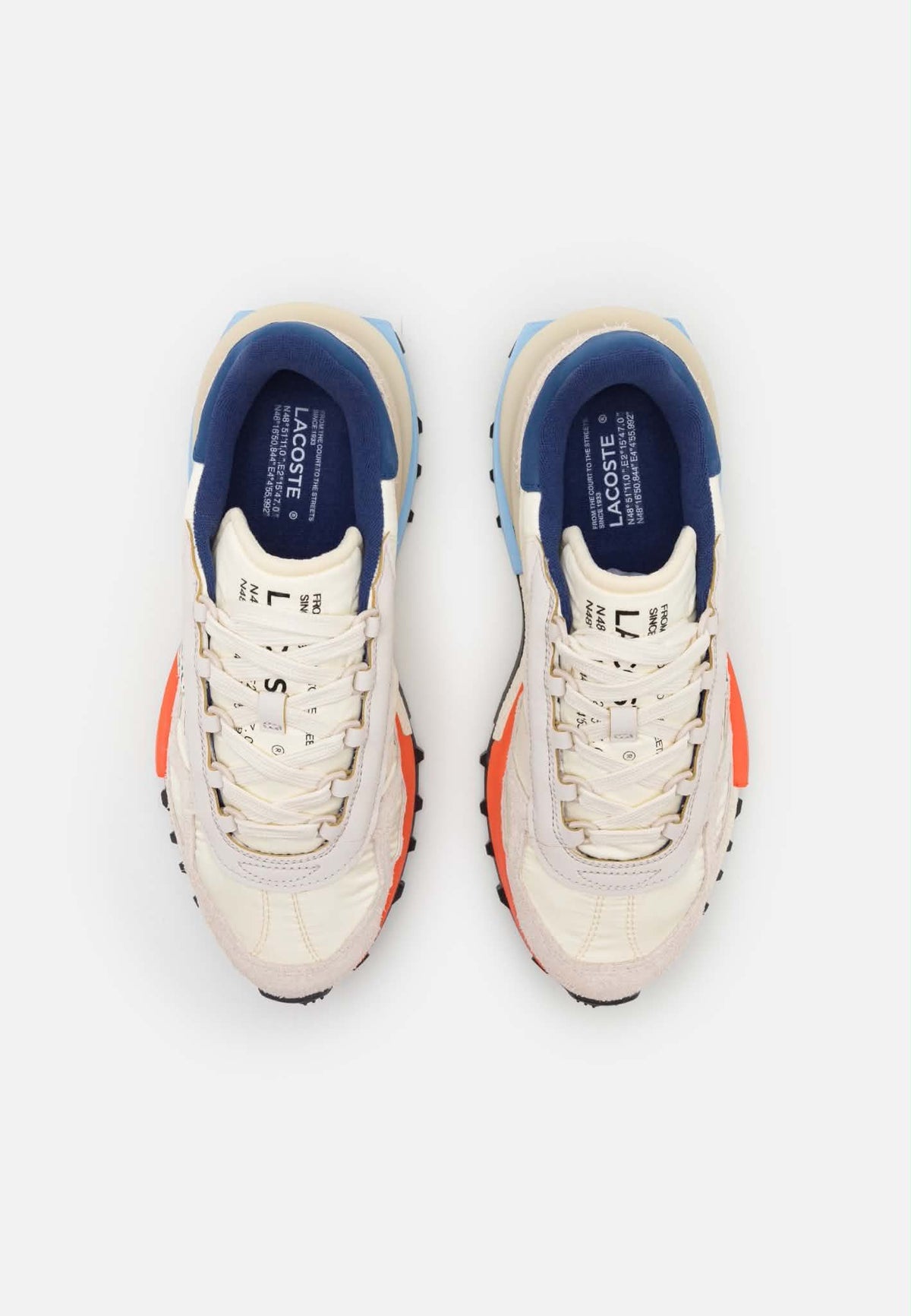 Basket Lacoste Elite Active en coloris écru et marine