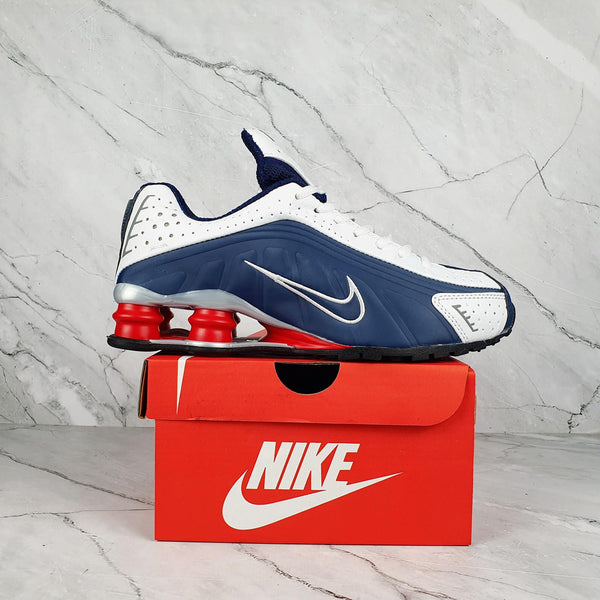 Nike Shox R4 White/Blue with Red Accents.