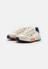 basket Lacoste Elite Active en coloris écru et marine