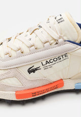 basket Lacoste Elite Active en coloris écru et marine
